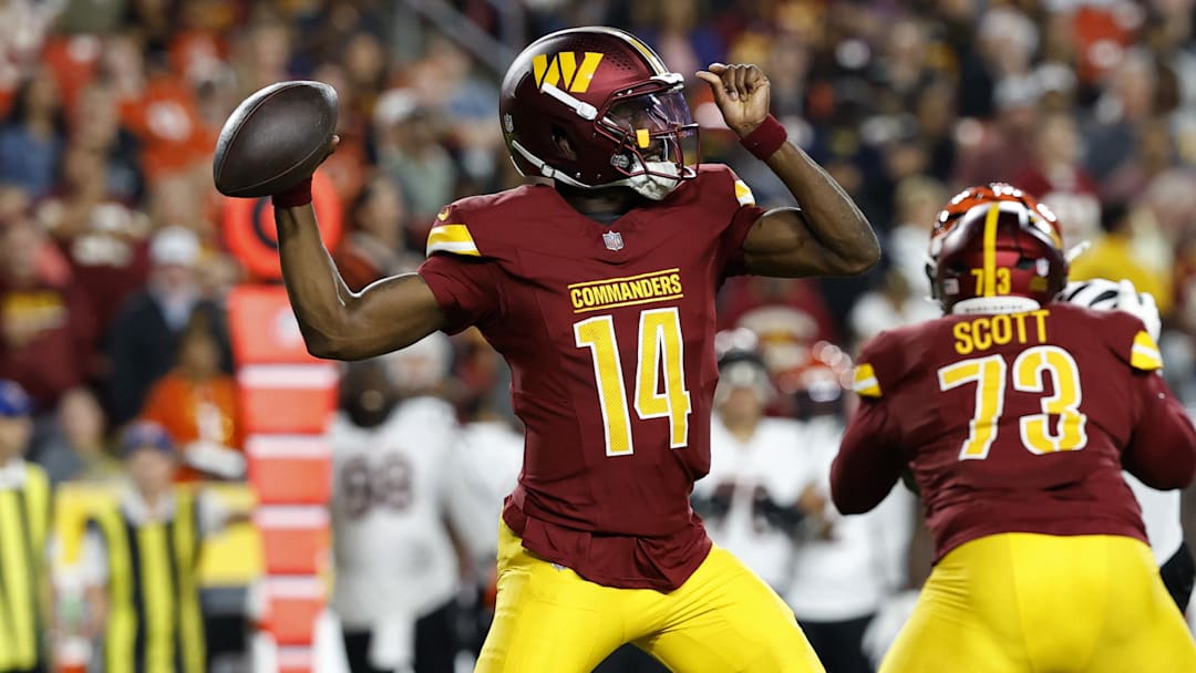 Aug 18, 2025; Landover, Maryland, USA; Washington Commanders quarterback Josh Johnson (14) passes the ball against the Cincinnati Bengals during the second quarter at Northwest Stadium. Mandatory Credit: Geoff Burke-Imagn Images