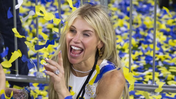 Feb 13, 2022; Inglewood, CA, USA; Kelly Stafford, wife of Los Angeles Rams quarterback Matthew Stafford (not pictured) plays with their daughters in the confetti as they celebrate after defeating the Cincinnati Bengals during Super Bowl LVI at SoFi Stadium. 