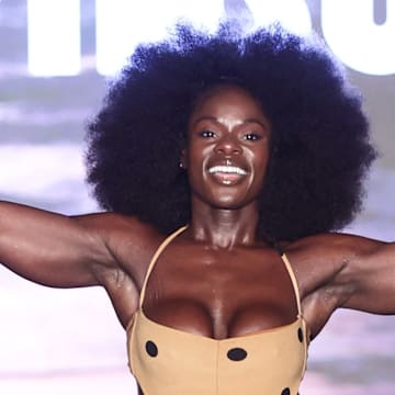 Tunde Oyeneyin walks the runway for the Sports Illustrated Swimsuit Runway Show
