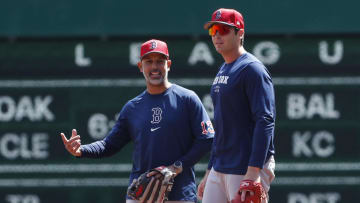 Apr 20, 2024; Pittsburgh, Pennsylvania, USA; Boston Red Sox manager Alex Cora (13) and first baseman Triston Casas (right) talk on the field before the game against the Pittsburgh Pirates at PNC Park.