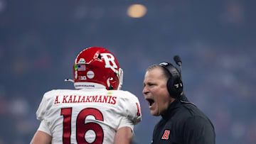 Dec 26, 2024; Phoenix, AZ, USA; Rutgers Scarlet Knights head coach Greg Schiano celebrates a touchdown with quarterback Athan Kaliakmanis (16) against the Kansas State Wildcats during the Rate Bowl at Chase Field. Mandatory Credit: Mark J. Rebilas-Imagn Images