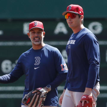 Apr 20, 2024; Pittsburgh, Pennsylvania, USA; Boston Red Sox manager Alex Cora (13) and first baseman Triston Casas (right) talk on the field before the game against the Pittsburgh Pirates at PNC Park.