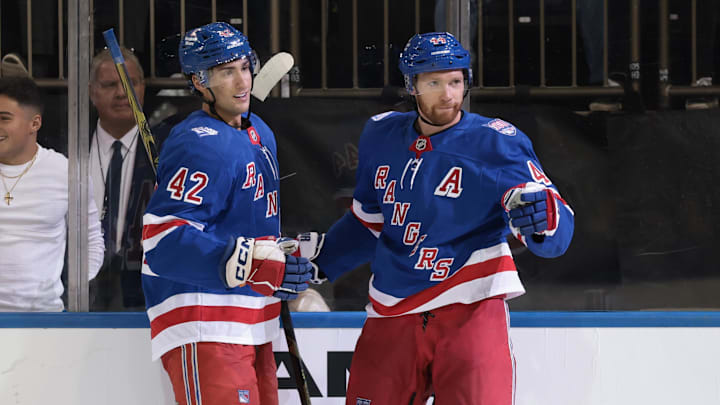 Sep 23, 2025; New York, New York, USA; New York Rangers defenseman Vladislav Gavrikov  (44) celebrates his goal with center Noah Laba (42) during the second period of a preseason game against the Boston Bruins at Madison Square Garden. Mandatory Credit: Vincent Carchietta-Imagn Images