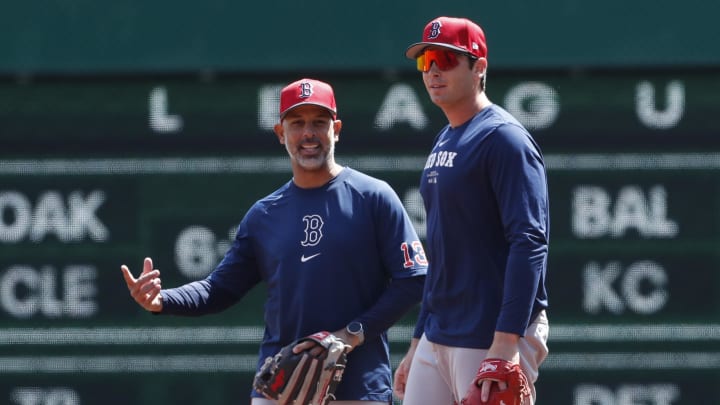 Apr 20, 2024; Pittsburgh, Pennsylvania, USA; Boston Red Sox manager Alex Cora (13) and first baseman Triston Casas (right) talk on the field before the game against the Pittsburgh Pirates at PNC Park.