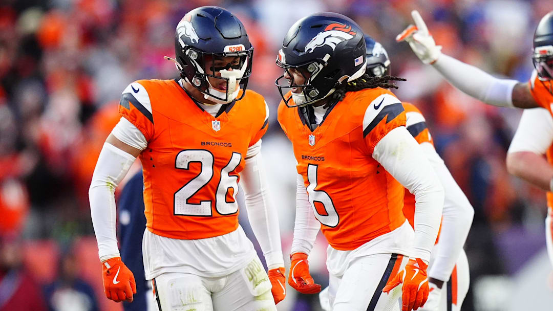 Denver Broncos safety P.J. Locke and Devon Key