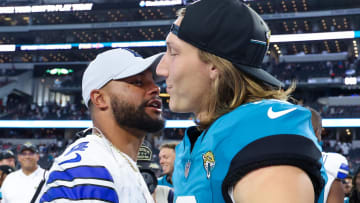 Aug 12, 2023; Arlington, Texas, USA;  Dallas Cowboys quarterback Dak Prescott (4) greets Jacksonville Jaguars quarterback Trevor Lawrence (16) after the game at AT&T Stadium. Mandatory Credit: Kevin Jairaj-USA TODAY Sports