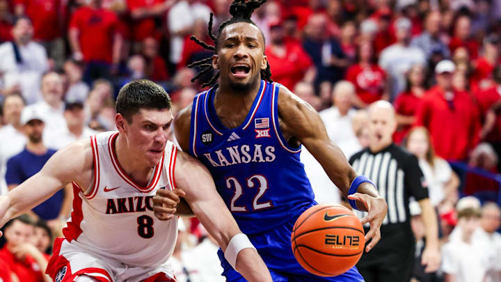 Feb 28, 2026; Tucson, Arizona, USA; Arizona Wildcats forward Ivan Kharchenkov (8) fouls Kansas Jayhawks guard Darryn Peterson (22) during the first half of the game at McKale Memorial Center. Mandatory Credit: Aryanna Frank-Imagn Images