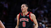 Utah Utes forward Keanu Dawes (8) holds up a three after he makes a three pointer during the first half against the Arizona Wildcats at McKale Center.