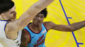February 14, 2025; San Francisco, California, USA; Team G-League guard Dink Pate (1) of the Mexico City Capitanes drives to the basket against Team C forward Zach Edey (14) of the Memphis Grizzlies during the 2025 NBA Rising Stars Game at Chase Center. Mandatory Credit: Kyle Terada-Imagn Images