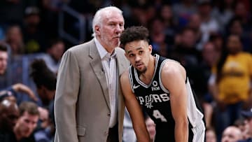 Apr 16, 2019; Denver, CO, USA; San Antonio Spurs head coach Gregg Popovich talks with guard Derrick White (4) in the second quarter against the Denver Nuggets in game two of the first round of the 2019 NBA Playoffs at the Pepsi Center.