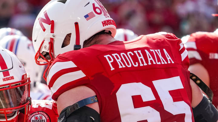 Sep 23, 2023; Lincoln, Nebraska, USA; Nebraska Cornhuskers running back Anthony Grant (23) and offensive lineman Teddy Prochazka (65) celebrate after a touchdown by Grant against the Louisiana Tech Bulldogs during the third quarter at Memorial Stadium. 