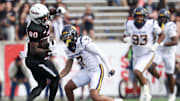 Nov 1, 2025; Houston, Texas, USA; Houston Cougars wide receiver Jaquise Martin (80) catches a pass against West Virginia Mountaineers safety Israel Boyce (7)  in the second half at TDECU Stadium. Mandatory Credit: Thomas Shea-Imagn Images