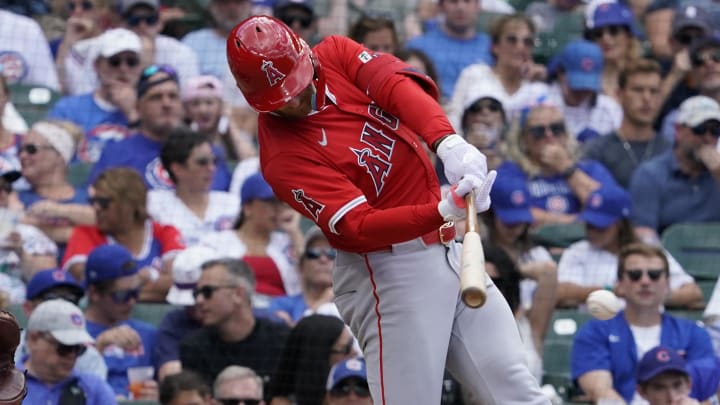 Jul 5, 2024; Chicago, Illinois, USA; Los Angeles Angels outfielder Taylor Ward (3) hits a one run single against the Chicago Cubs during the fifth inning at Wrigley Field.