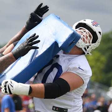 Bills offensive lineman Dion Dawkins collides with Alec Anderson during position drills during day three of Buffalo Bills training camp at St. John Fisher University Friday, July 25, 2025 in Pittsford, NY.