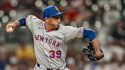 Aug 23, 2025; Cumberland, Georgia, USA; New York Mets relief pitcher Edwin Diaz (39) pitches against the Atlanta Braves during the ninth inning at Truist Park. Mandatory Credit: Dale Zanine-Imagn Images