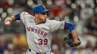 Aug 23, 2025; Cumberland, Georgia, USA; New York Mets relief pitcher Edwin Diaz (39) pitches against the Atlanta Braves during the ninth inning at Truist Park. Mandatory Credit: Dale Zanine-Imagn Images
