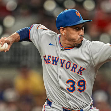 Aug 23, 2025; Cumberland, Georgia, USA; New York Mets relief pitcher Edwin Diaz (39) pitches against the Atlanta Braves during the ninth inning at Truist Park. Mandatory Credit: Dale Zanine-Imagn Images