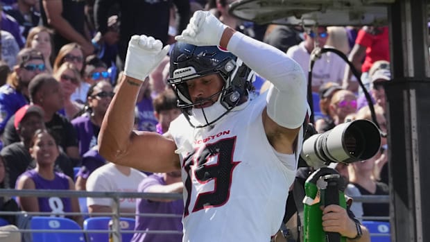 Houston Texans wide receiver Xavier Hutchinson reacts after a touchdown during the first quarter against the Baltimore Raven