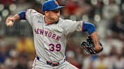 Aug 23, 2025; Cumberland, Georgia, USA; New York Mets relief pitcher Edwin Diaz (39) pitches against the Atlanta Braves during the ninth inning at Truist Park. Mandatory Credit: Dale Zanine-Imagn Images