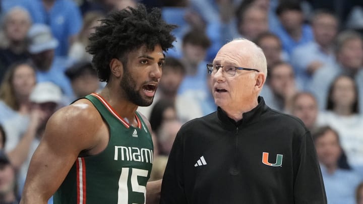 Feb 26, 2024; Chapel Hill, North Carolina, USA; Miami (Fl) Hurricanes forward Norchad Omier (15) with head coach Jim Larranaga in the second half at Dean E. Smith Center. Mandatory Credit: Bob Donnan-USA TODAY Sports