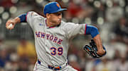 Aug 23, 2025; Cumberland, Georgia, USA; New York Mets relief pitcher Edwin Diaz (39) pitches against the Atlanta Braves during the ninth inning at Truist Park. Mandatory Credit: Dale Zanine-Imagn Images