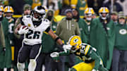 Philadelphia Eagles running back Saquon Barkley (26) spins out of a tackle by Green Bay Packers cornerback Carrington Valentine (24) on Monday, November 10, 2025, at Lambeau Field in Green Bay, Wis. The Eagles won the game, 10-7.