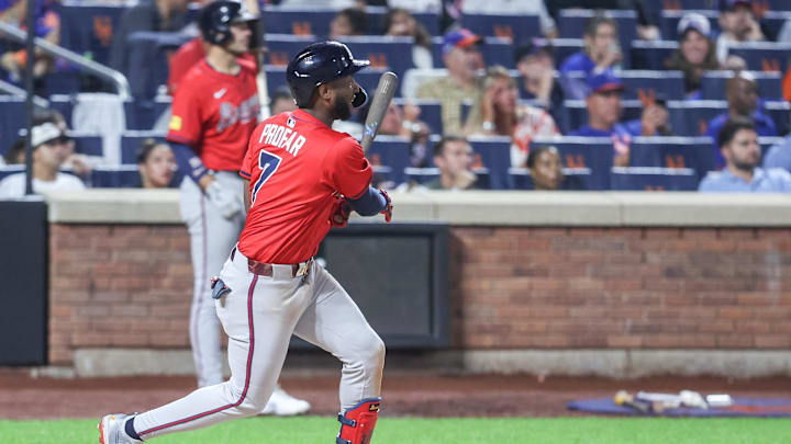 Aug 13, 2025; New York City, New York, USA;  Atlanta Braves left fielder Jurickson Profar (7) hits a three run double in the fourth inning against the New York Mets at Citi Field. Mandatory Credit: Wendell Cruz-Imagn Images