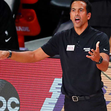 Sep 6, 2020; Lake Buena Vista, Florida, USA; Miami Heat head coach Erik Spoelstra reacts as he talks with forward Bam Adebayo (13) during the second half of game four of the second round of the 2020 NBA Playoffs against the Milwaukee Bucks at ESPN Wide World of Sports Complex. Mandatory Credit: Kim Klement-Imagn Images