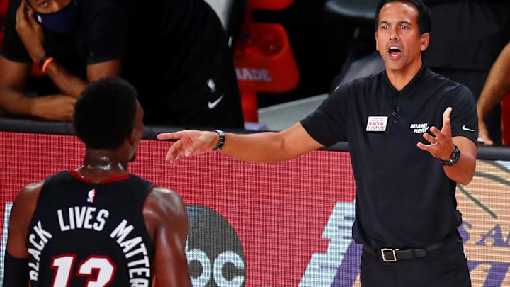 Sep 6, 2020; Lake Buena Vista, Florida, USA; Miami Heat head coach Erik Spoelstra reacts as he talks with forward Bam Adebayo (13) during the second half of game four of the second round of the 2020 NBA Playoffs against the Milwaukee Bucks at ESPN Wide World of Sports Complex. Mandatory Credit: Kim Klement-Imagn Images