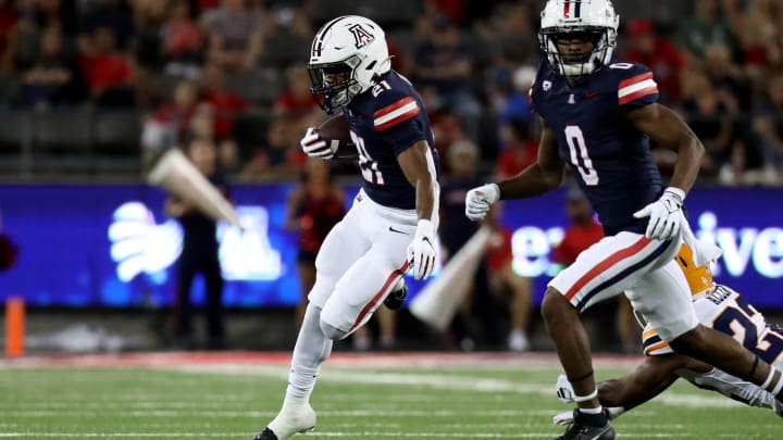 Sep 16, 2023; Tucson, Arizona, USA; Arizona Wildcats running back Rayshon Luke (21) runs the ball against the UTEP Miners during the second half at Arizona Stadium. 