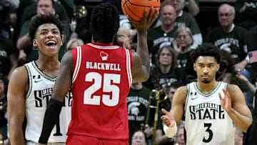  Mar 2, 2025; East Lansing, Michigan, USA;  Michigan State Spartans guard Jeremy Fears Jr. (1) and teammate guard Jaden Akins (3) celebrate as the clock winds down on Wisconsin Badgers guard John Blackwell (25) at Jack Breslin Student Events Center. Mandatory Credit: Dale Young-Imagn Images