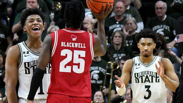  Mar 2, 2025; East Lansing, Michigan, USA;  Michigan State Spartans guard Jeremy Fears Jr. (1) and teammate guard Jaden Akins (3) celebrate as the clock winds down on Wisconsin Badgers guard John Blackwell (25) at Jack Breslin Student Events Center. Mandatory Credit: Dale Young-Imagn Images