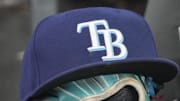 Sep 26, 2025; Toronto, Ontario, CAN; The hat and glove of Tampa Bay Rays third baseman Junior Caminero (13) in the dugout during the game against the Toronto Blue Jays at Rogers Centre. 
