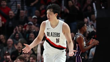 Oct 10, 2025; Portland, Oregon, USA;  Oct 10, 2025; Portland, Oregon, USA;  Portland Trail Blazers center Yang Hansen  (16) reacts after not getting a foul against Sacramento Kings in the second half at Moda Center. Mandatory Credit: Jaime Valdez-Imagn Images