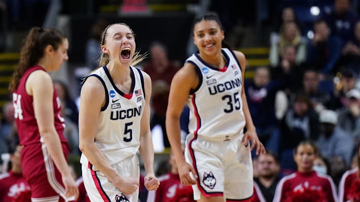 Mar 26, 2022; Bridgeport, CT, USA; UConn Huskies guard Paige Bueckers (5) and guard Azzi Fudd (35) react after a play against the Indiana Hoosiers during the second half in the Bridgeport regional semifinals of the women's college basketball NCAA Tournament at Webster Bank Arena. Mandatory Credit: David Butler II-Imagn Images