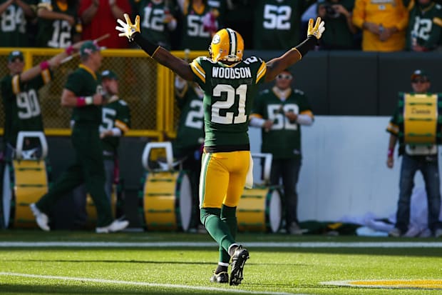  Green Bay Packers defensive back Charles Woodson (21) celebates his touchdown against the Denver Broncos in 2011.