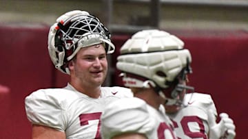 April 9, 2024; Tuscaloosa, Alabama, USA; Alabama offensive lineman Wilkin Formby (75) smiles at a teammate during practice in the Hank Crisp Indoor Practice Facility at the University of Alabama.