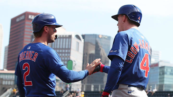 Sep 17, 2025; Pittsburgh, Pennsylvania, USA; Chicago Cubs second baseman Nico Hoerner (2) celebrates scoring a run with center fielder Pete Crow-Armstrong (4)  against the Pittsburgh Pirates during the sixth inning at PNC Park. Mandatory Credit: Charles LeClaire-Imagn Images