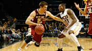 Dec 28, 2013; Brooklyn, NY, USA;  Boston College Eagles guard Joe Rahon (25) drives around Virginia Commonwealth Rams guard Rob Brandenberg (11) during the second half at Barclays Center. Virginia Commonwealth Rams won 69-50.  Mandatory Credit: Anthony Gruppuso-USA TODAY Sports