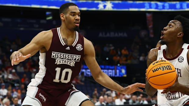 South Carolina guard Jermaine Couisnard (5) drives to the basket as Mississippi State forward Garrison Brooks (10)
