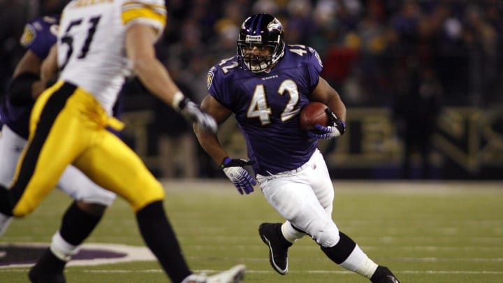 Dec 14, 2008; Baltimore, MD, USA; Baltimore Ravens running back Lorenzo Neal (42) carries the ball as Pittsburgh Steelers linebacker James Farrior (51) defends in the first half at M&T Bank Stadium. Mandatory Credit: Geoff Burke-USA TODAY Sports