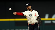 Texas Rangers second baseman Marcus Semien (2) throws to first base during the seventh inning against the Philadelphia Phillies at Globe Life Field. 