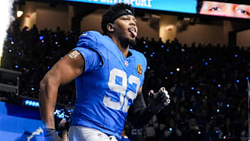 Detroit Lions defensive end Marcus Davenport (92) runs onto the field for players introduction before the Thanksgiving game