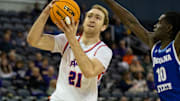 Evansville's Connor Turnbull (21) goes up for a shot for the Evansville Purple Aces 