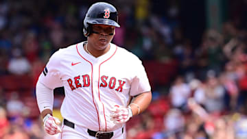 Boston Red Sox third baseman Rafael Devers (11) runs the bases after hitting a three-run home run against the Arizona Diamondbacks during the fourth inning at Fenway Park.