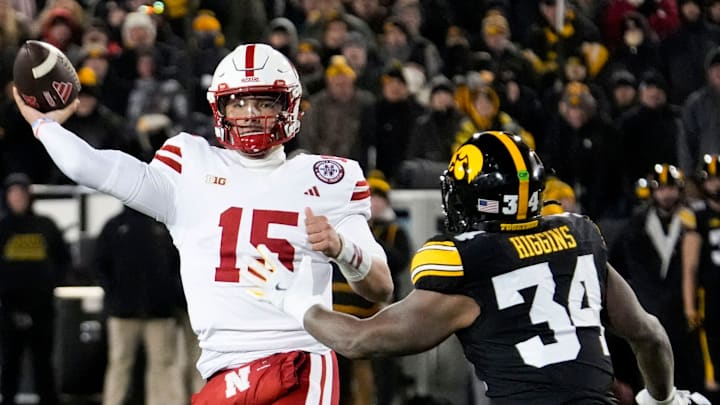 Nebraska Cornhuskers quarterback Dylan Raiola (15) passes as Iowa Hawkeyes linebacker Jay Higgins (34) defends Friday, Nov. 29, 2024 at Kinnick Stadium in Iowa City, Iowa. Nebraska Cornhuskers quarterback Dylan Raiola (15) passes as Iowa Hawkeyes linebacker Jay Higgins (34) defends Friday, Nov. 29, 2024 at Kinnick Stadium in Iowa City, Iowa.