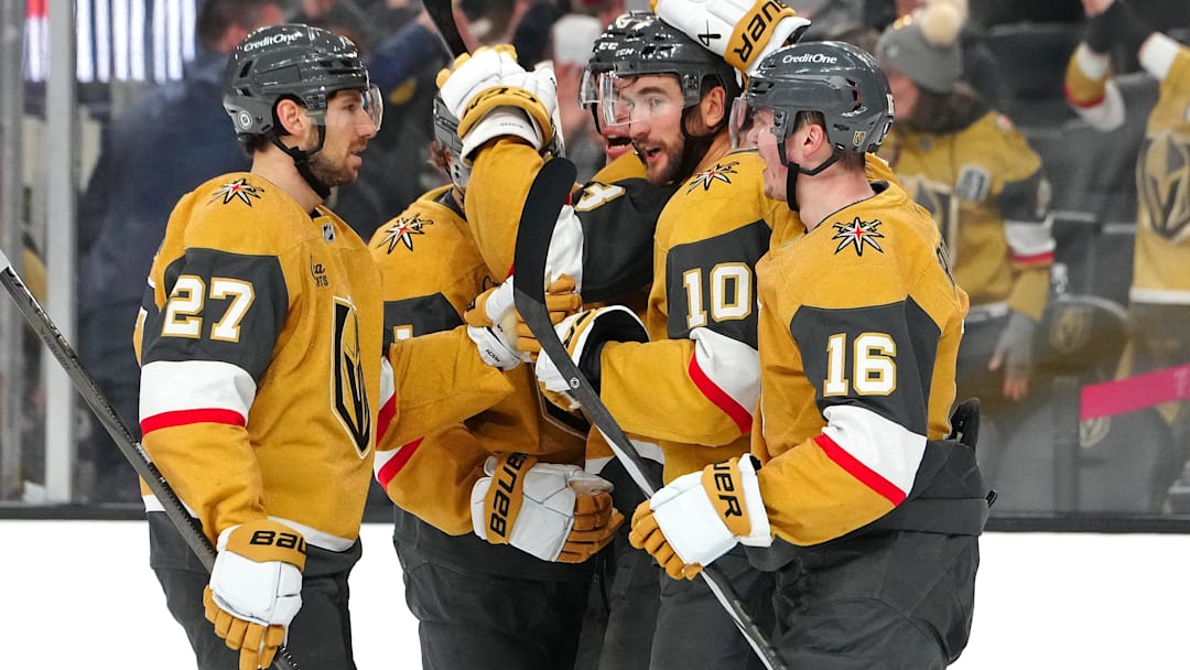 Dec 6, 2024; Las Vegas, Nevada, USA; Vegas Golden Knights center Nicolas Roy (10) celebrates with Vegas Golden Knights defenseman Shea Theodore (27) and Vegas Golden Knights left wing Pavel Dorofeyev (16) after scoring a goal against the Dallas Stars during the second period at T-Mobile Arena. Mandatory Credit: Stephen R. Sylvanie-Imagn Images