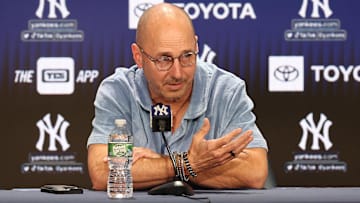 Aug 23, 2023; Bronx, New York, USA; New York Yankees general manager Brian Cashman talks with the media before the game between the Yankees and the Washington Nationals at Yankee Stadium. Mandatory Credit: Vincent Carchietta-Imagn Images
