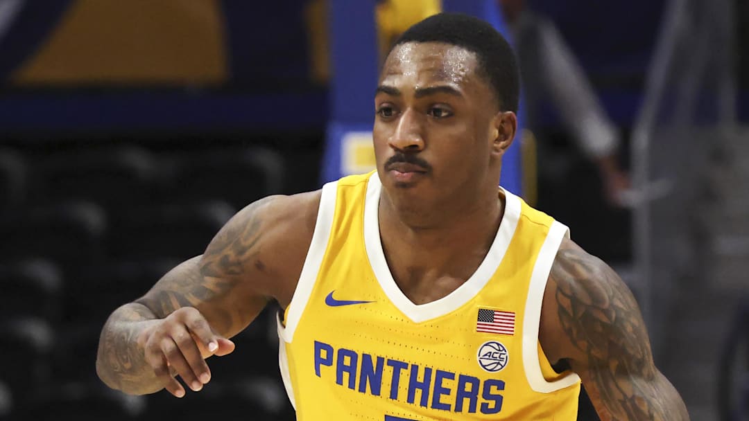 Jan 24, 2026; Pittsburgh, Pennsylvania, USA;  Pittsburgh Panthers guard Damarco Minor (7) brings the ball up court against the NC State Wolfpack during the second half at the Petersen Events Center. Mandatory Credit: Charles LeClaire-Imagn Images