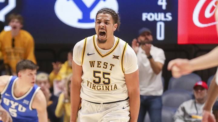 Feb 28, 2026; Morgantown, West Virginia, USA; West Virginia Mountaineers center Harlan Obioha (55) celebrates after a score during the first half against the BYU Cougars at Hope Coliseum. Mandatory Credit: Ben Queen-Imagn Images
